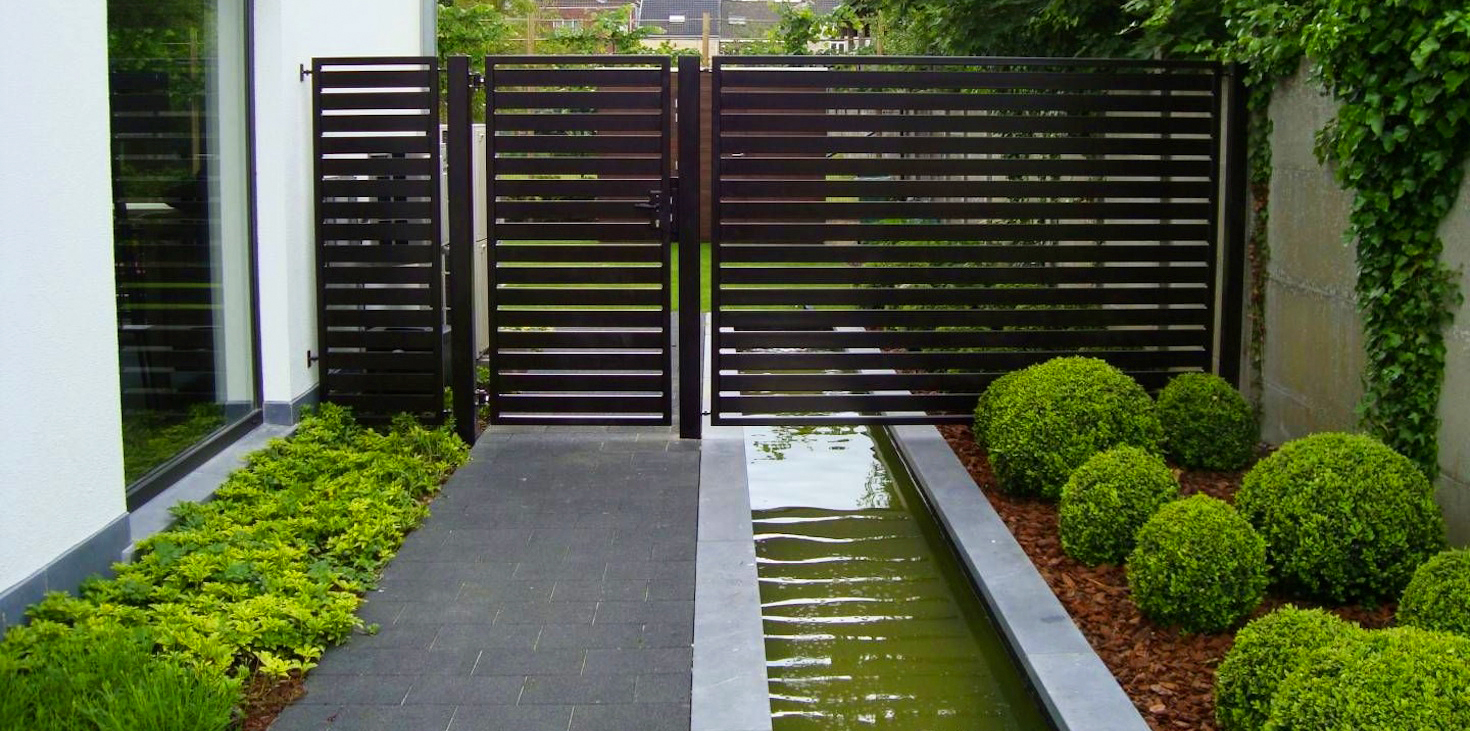 a wooden horizontal fence with a water canal running below. fence made by sterling VA fencing services